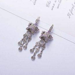 Fashion-and American Explosion Model s925 Silver Needle Plated Real Gold Micro Set Zircon Lion Coin Tassel Earring
