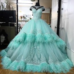 Gorgeous Mint Quinceanera Dresses With Sheer Neckline Lacer Appliques Sequins Beads Tiered Feathers Prom Dress Girls Pageant Gowns