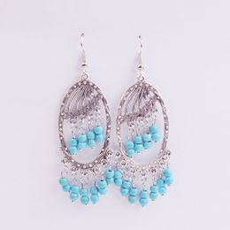 European and American fashion retro water drops blue turquoise tassel earrings long section hollow rice beads bohemian national wind earring