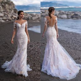 2020 Sheer Long Sleeves Lace Mermaid Beach Wedding Dresses Jewel Neck Appliques Illusion Sweep Train Dubai Bridal Gowns With Butto229u