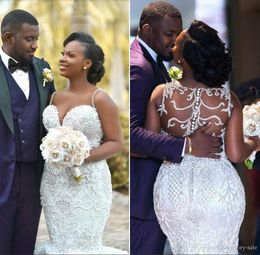 Sexig Tillbaka Design Mermaid Bröllopsklänningar Appliques Beadings Sweetheart Neck Bridal Gown African Robe de Marie