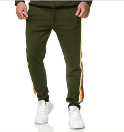 Pantaloni sportivi casual da uomo autunno 2019 Pantaloni lunghi di personalità del nastro di differenza di colore laterale Pantaloni lunghi da uomo di grandi dimensioni con tinta unita