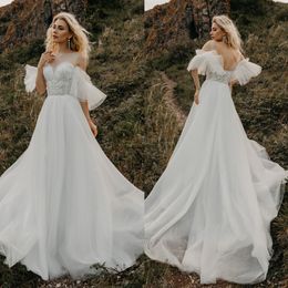 Bohemian Beach Wedding Dresses Sheer Jewel Neck Ruffles Short Sleeve Appliqued Bridal Gowns Sequins Flower Sweep Train Wedding Dress