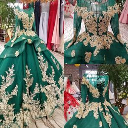 2020 Custom Made Prom Dresses Long Sleeves Hollow Back Gold Lace Appliqued Evening Dress with Peplum Beaded Arabic Formal Gowns