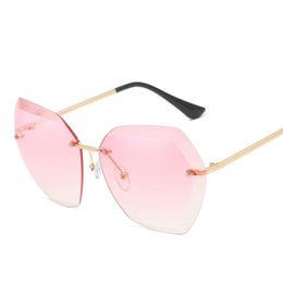 The new European and American fashion sunglasses rimless glasses trimming metal UV400 sunglasses female sunglasses wholesale