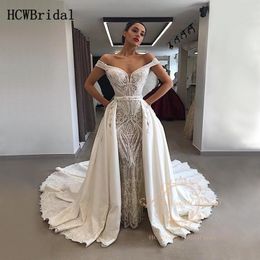 2020 Glamouröse Meerjungfrau-Spitze-Arabisch-Hochzeitskleider aus der Schulter, abnehmbarer Zug, individuell anpassbare Dubai-Hochzeitskleider Robe De Mariee