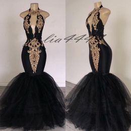 black prom dress with gold embroidery