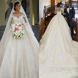 Gorgeous Ball Gown Wedding Dresses Bateau Sheer Neck Crystals Ruffles Appliques Long Illusion Sleeves Plus Size Wedding Dress Bridal Gowns