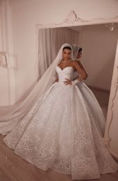 Luxury Wedding Dresses Jewel Neck Crystal Beaded Appliqued Long Sleeves Bridal Gowns Ruffled Sweep Train Custom Made Robes De Mariée