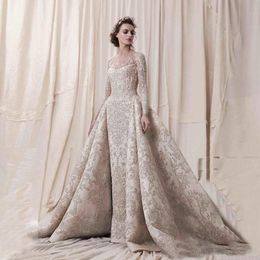 Illusions-Langarm-Brautkleider mit Spitzenapplikation, durchsichtige, mit Knöpfen bedeckte, bodenlange, formelle Brautkleider