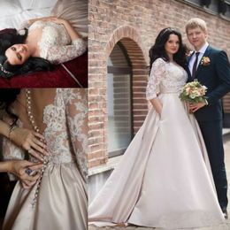Plus -storlek Senaste Dubai Arabiska illusion Halva ärmar Lace Applique Brudklänningar med fickor Satin Bröllopsklänningar billiga