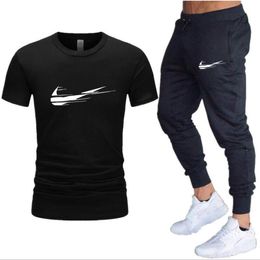 Moda gündelik marka erkek kadın spor giyim takım elbise giyim erkek jogging eşofman tertmaları 2 adet koşu setleri tişörtler + pantolon