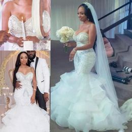 2019 Sexy African Mermaid Wedding Dresses Sweetheart Sleeveless Crystal Beaded Tiered Ruffles Organza Sweep Train Black Girls Bridal Gowns