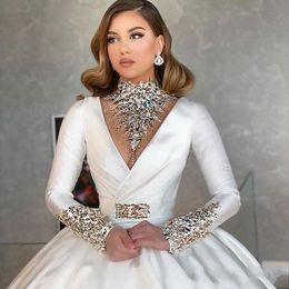 2020 Dubai Arabic High Neck Satin Ball Gown Wedding Dresses Sparkly Crystals Beaded V Neck Long Sleeve Illusion Back Bridal Gowns 181T