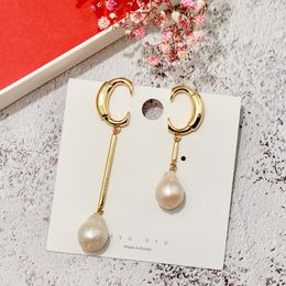 Wholesale- copper-plated Jewellery Europe and America INS shaped natural pearl asymmetric C-shaped earrings