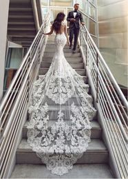 Luxury Beaded Mermaid Wedding Dresses 2020 Sweetheart Cap Sleeve Backless Long Tail Applique Lace Button Back Bride Dress