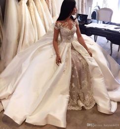 2020 New Sexy Mermaid Wedding Dresses Jewel Neck Lace Appliqued Crystal Beading Cap Sleeves Detachable Train Overskirts Formal Bridal Gowns