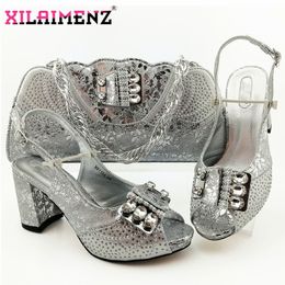 silver grey shoes and matching bolsa