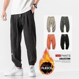 orange stacked sweatpants