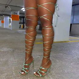 thigh high lace up flat sandals