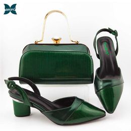 green shoes and matching bolsa