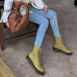 green cross ankle boots