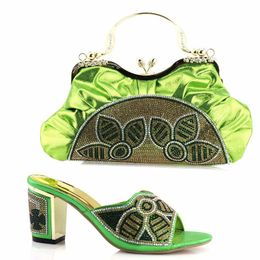 green shoes and matching bolsa