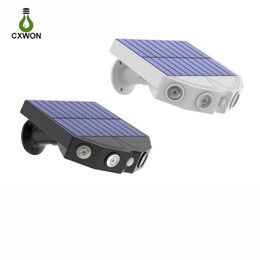 Paquete de 2 piezas Lámparas solares para exteriores Diseño de monitoreo de imitación Luz de calle 4LED Sensor de movimiento Lámpara de pared impermeable para jardín Courtyar304H