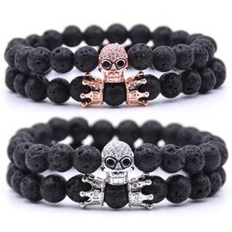 2pcs / set Couronne Crâne Bracelet En Pierre Naturelle Perles De Pierre De Lave Bracelet Roche Volcanique Huile Essentielle Diffuseur Bracelet Bijoux Main Cordes