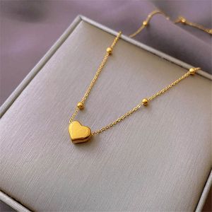 3 colores Diseño conciso Collares pendientes Cadenas delgadas con bolas pequeñas y decoración de corazón Collar de cadena de cuentas de mujer de lujo al por mayor