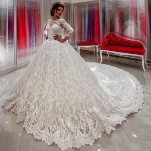 Ball Gown New Wedding Dresses Sheer Neck Illusion Three Quarter Sleeves Lace Applique Beads Open Back Sash Bow Cathedral Train Bridal Gowns s