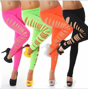 Hot Sale Candy Färg Solid Färg Hål Out Club Byxor Tight Stretchy Side Ripped Sexy Cutting-Out Ankel Längd Leggings Drop Ship Tillgänglig