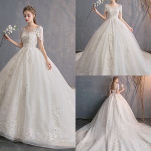 Modest YL Ball Gown Gioiello Manica corta Backless Lace Up Abiti da sposa Applique in pizzo Perline Abiti da sposa Sweep Train Abiti da sposa