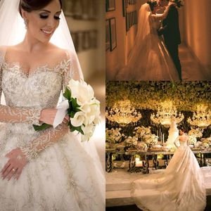 2019 New Luxurious Dubai Arabic A Line Wedding Dresses Lace Applique Beads Sequined Crystals Button Back Sheer Neck Long Sleeves Bridal Gown