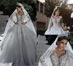 2019 Ny lyxiga pärlstavar arabiska bollklackar bröllopsklänningar glamorösa halvma ärmar tulle applikationer pärlstav pärlor pärlor monterade brudklänningar