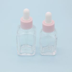 20 ml ätherisches Öl, quadratische Tropfflasche, 30 ml Klarglas-Serumflaschen mit rosa Verschluss für Kosmetika