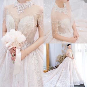 2020 YL Ball Gown High Neck Short Sleeve Hollow Wedding Dresses Lace Applique Crystal Tassel Pearls Wedding Gowns Sweep Train Bridal Gowns