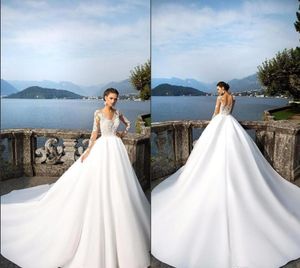 2020 plus rozmiar sukienki ślubne A-Line z długim rękawem Summer Beach Suknie ślubne Vintage Lace Vestido de Novia Illusion Powrót z przyciskami