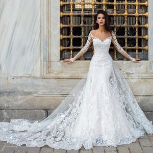 Abiti da sposa sirena in pizzo modesto overskirt in rilievo con maniche da sposa con maniche lunghe con maniche lunghe con taglio a cuore con perline