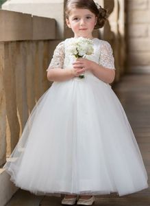 Vendita calda Abito da ragazza di fiore in pizzo Vestito da prima comunione per ragazze Abiti da ragazza di fiore adorabili in abito bianco per ragazze