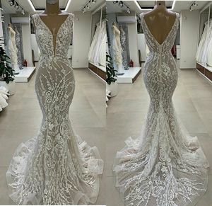 Abiti splendidi abiti da sposa con scollo a V in rilievo con applicazioni di pizzo a sirena eleganti abiti da sposa con strascico