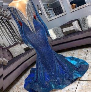 Pełne cekiny odblaskowe syrena niebieskie sukienki wieczorowe koraliki Sheer szyi długie rękawy Formalne suknie na imprezę z frędzlami Trai320h