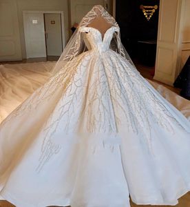 2022 Luxury Sparkly Dubai Ball Gown Wedding Dresses Off Shoulder Lace Beaded Silver Sequins Cap Sleeves Puffy Chapel Train Plus Size Formal Bridal Gowns