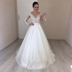 New African Ball Gown Wedding Dresses Jewel Neck Illusion Lace Appliques Beaded Long Sleeves Sweep Train Plus Size Formal Bridal Gowns