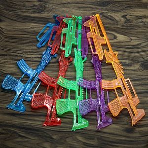 Gratis frakt 12 kristall super gummiband pistol färg gummiband pistol pojke student barn leksak hängande bräda runt skolan stall leksak