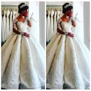 Lyxiga Dubai Arbic Långärmade Bollklänning Bröllopsklänningar Lace Appliques Modest Bridal Gowns Beaded Vestidos de Äktenskap Bröllopsklänning