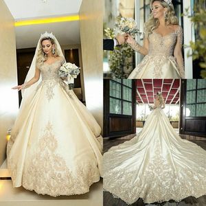 Luxuriöse Brautkleider mit Kathedralenschleppe und durchsichtigen, langärmligen, bestickten, perlenbesetzten, durchscheinenden Juwelen-Brautkleidern in Champagner