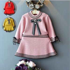 Maglioni e gonne per ragazze Set da 2 pezzi Fashion Bow Knitting Tops Gonne Tute Ragazze Articoli di alta qualità Set di abbigliamento per bambini