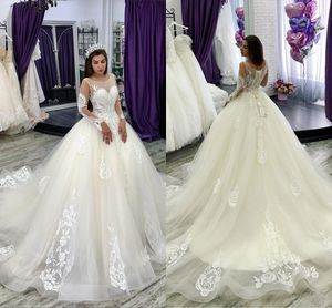 Modest Lace Ball Gown Bröllopsklänningar med katedralen Tåg Sheer Neck Lace Bridal Gowns Långärmad Vit arabisk bröllopsklänning Plus Storlek