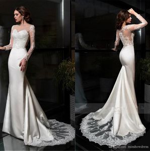 Sexy elegante weiße Spitze Meerjungfrau Kleider schiere lange Ärmel Satin Applique Hochzeit Brautkleider mit Knöpfen Roben de Marie